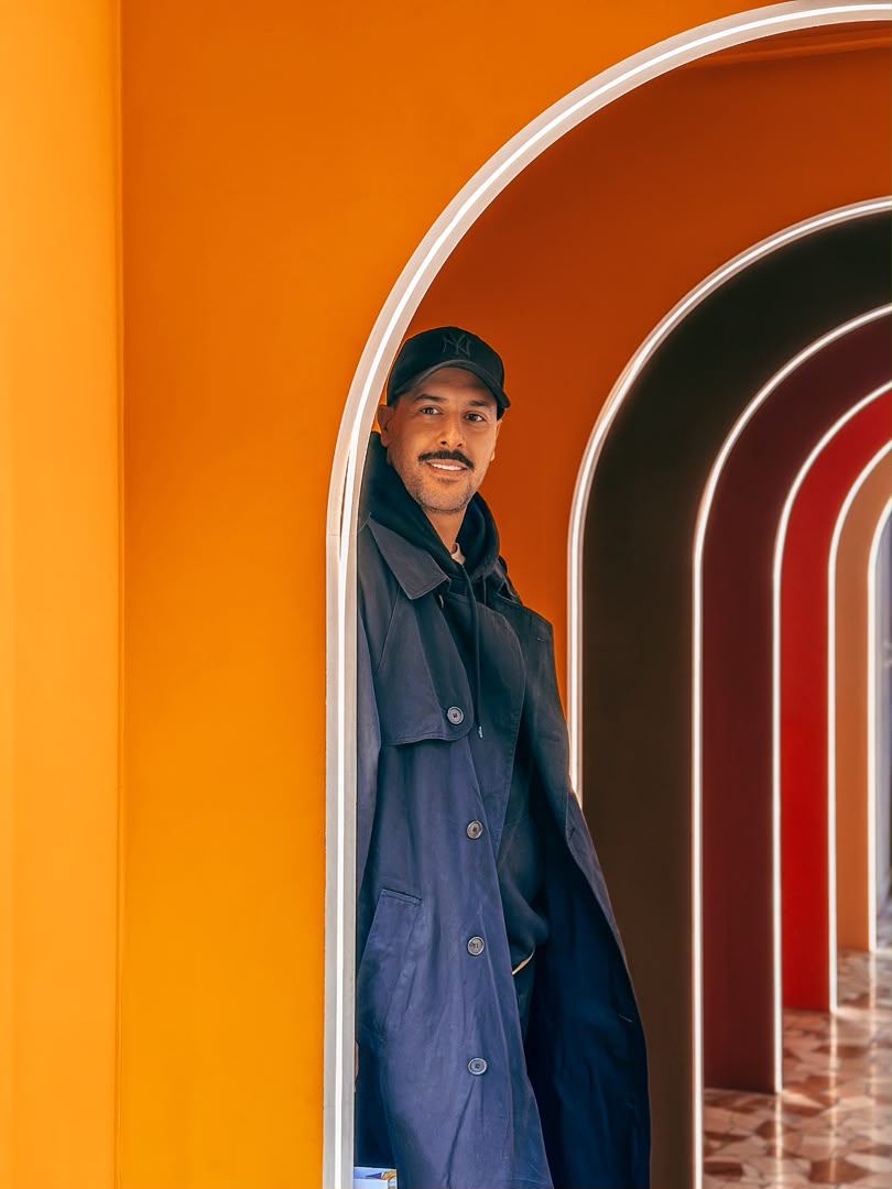 Iliya Keyvan framed by colorful architectural arches