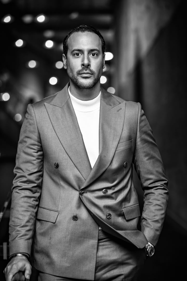 Black and white portrait of actor Iliya Keyvan in a tailored suit